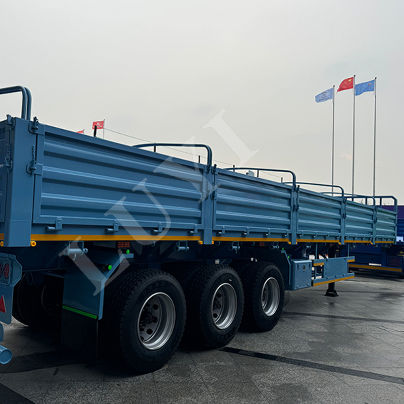 Africa special blue plate semi-trailer with a load of 60 tons for safe transportation of cargo Side 